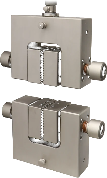 Metal tensile specimen clamped in mechanical wedge grips